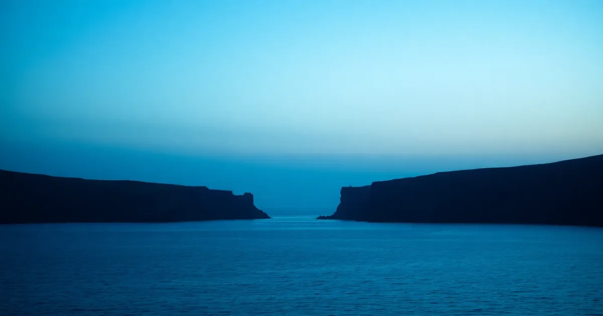 Two coastlines facing each other across a narrow strait, illustrating buying property in the UK as a US citizen