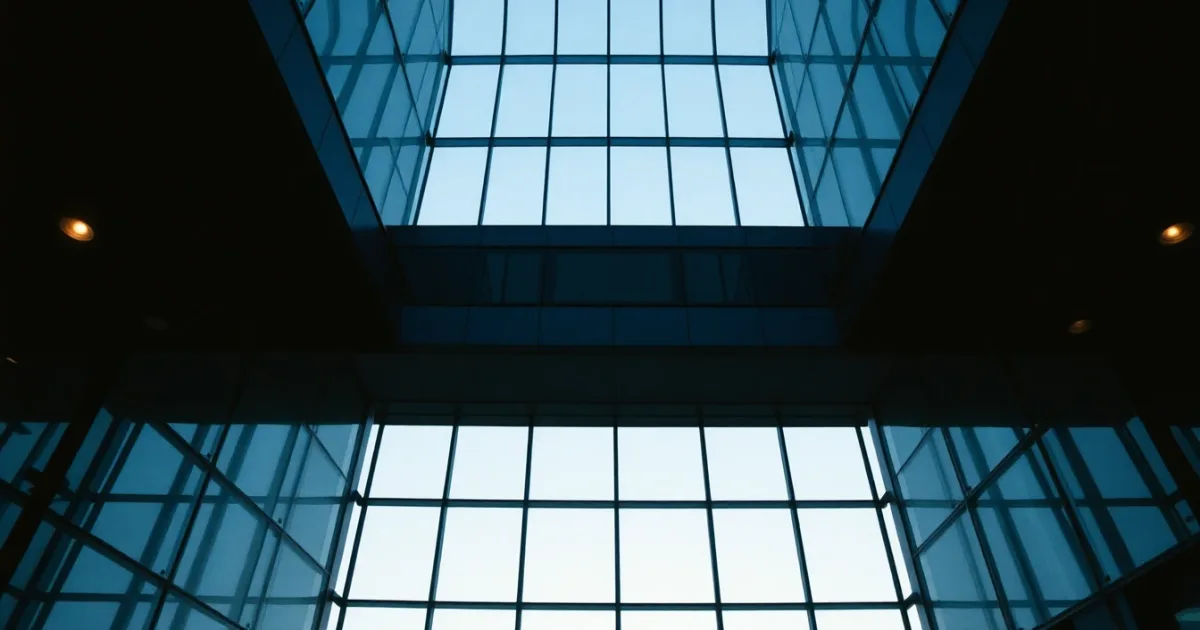 An empty steel and glass atrium seen from below, illustrating Dual-status tax return explained