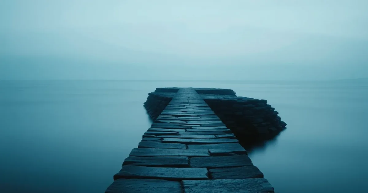 A stone causeway running out across still water at dusk, illustrating Mutual agreement procedure: the US-UK route