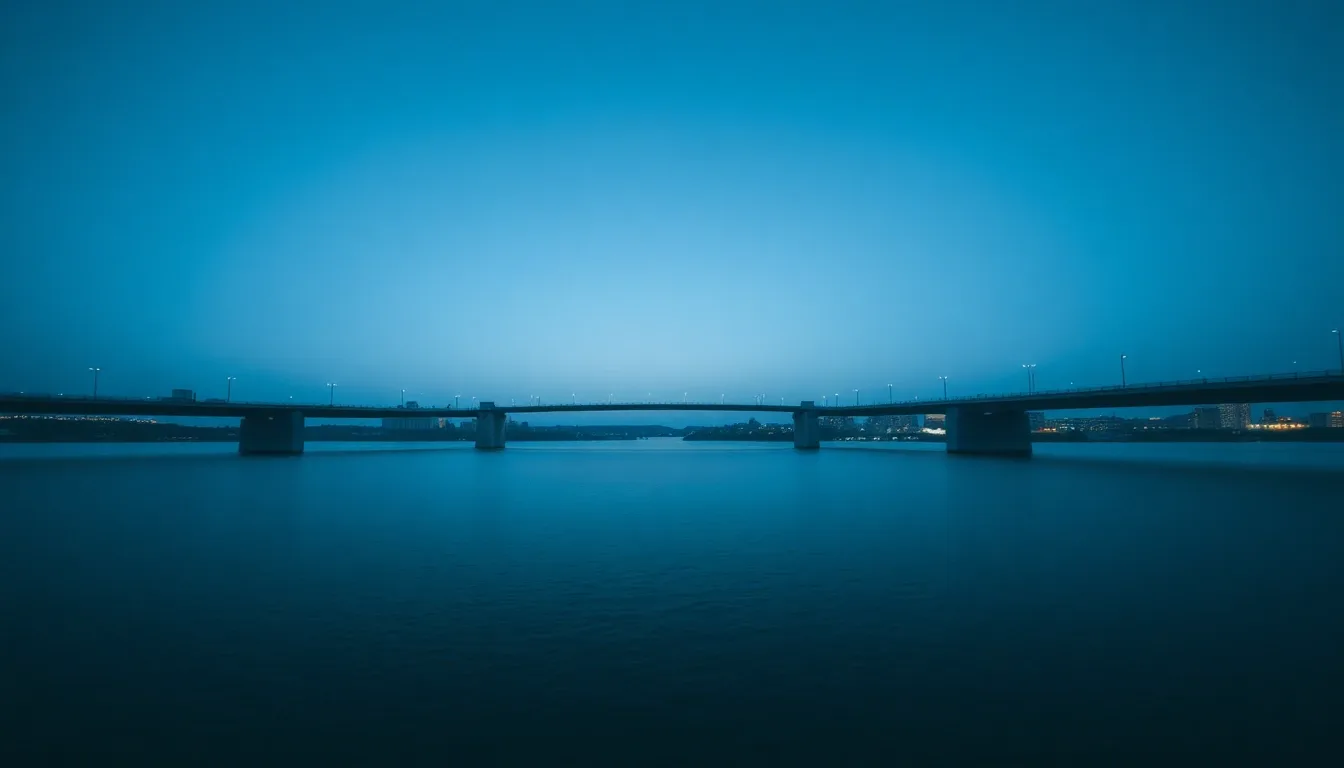 A suspension bridge photographed from the riverbank at dawn, illustrating Dividend withholding rate: the US-UK treaty